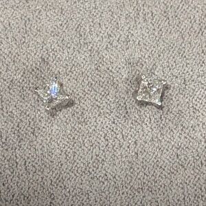 .25 CTW Princess Cut Diamond earrings.  
White gold
